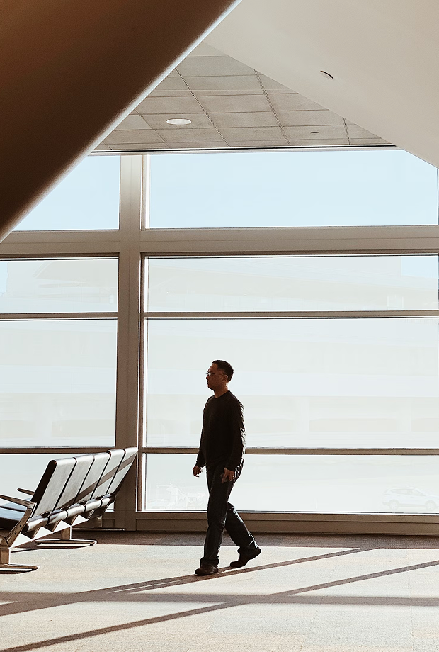 Passenger walking through an airport terminal